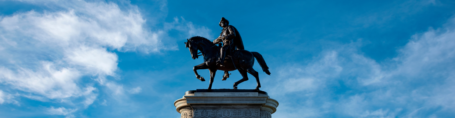 A statue of a person riding a horse.
