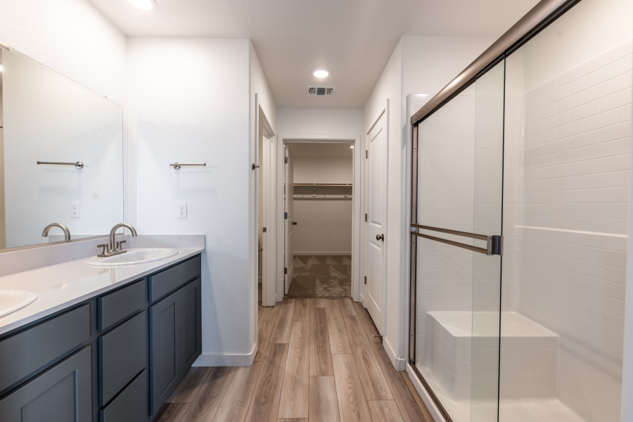 A bathroom with a glass shower.