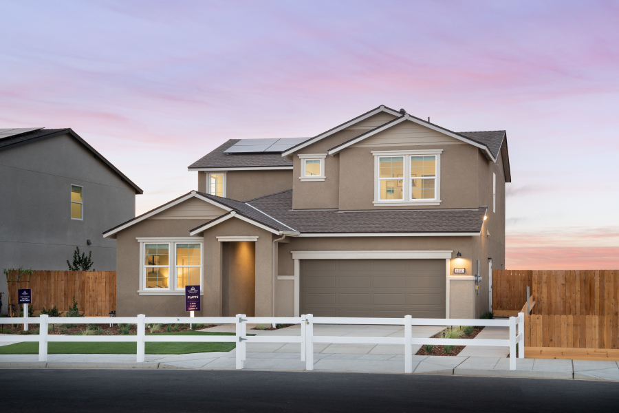 A house with a white picket fence.