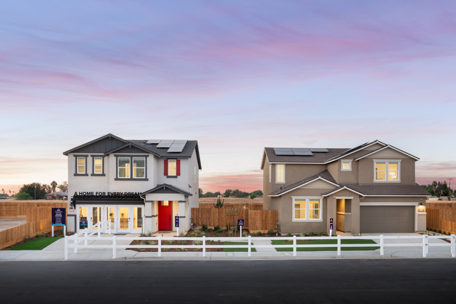 A house with a white picket fence.
