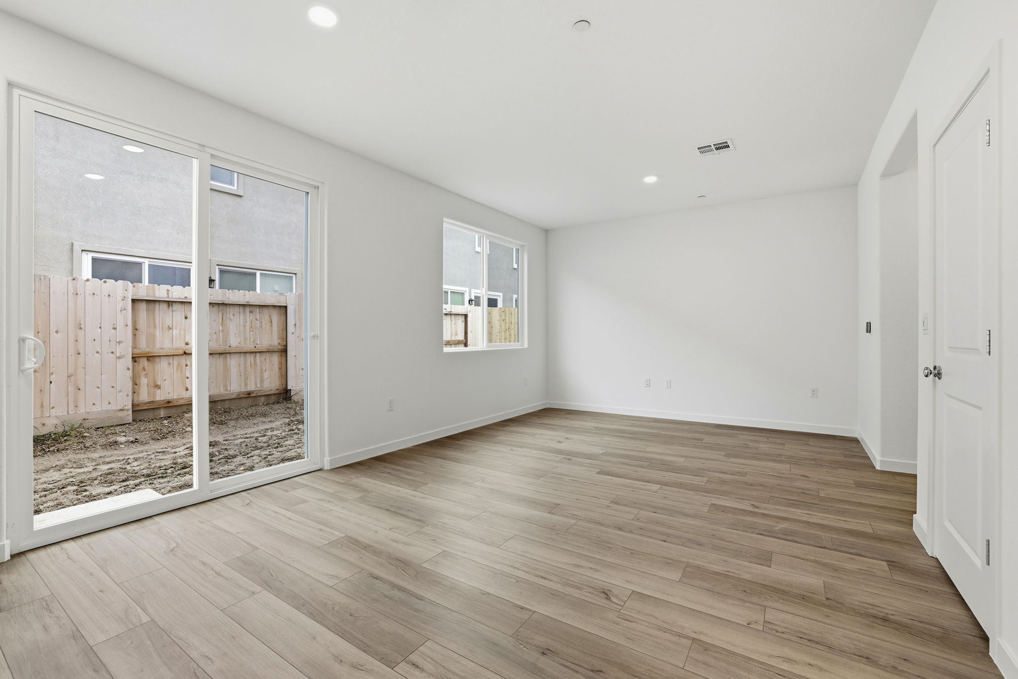 A room with a wood floor and a wood floor.