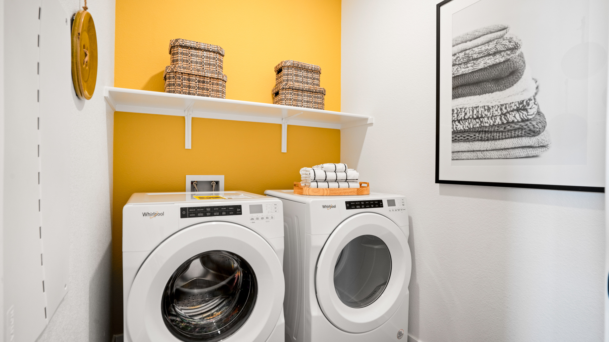 A laundry room with a dryer and dryer.
