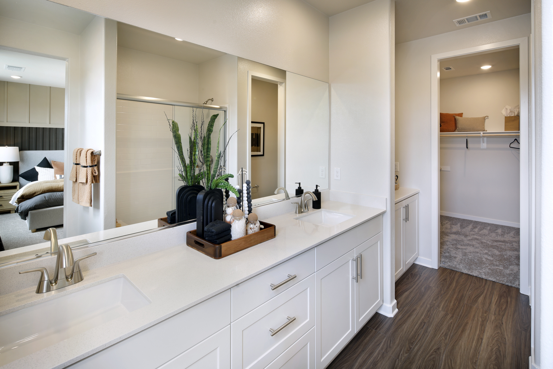 A bathroom with a large mirror.