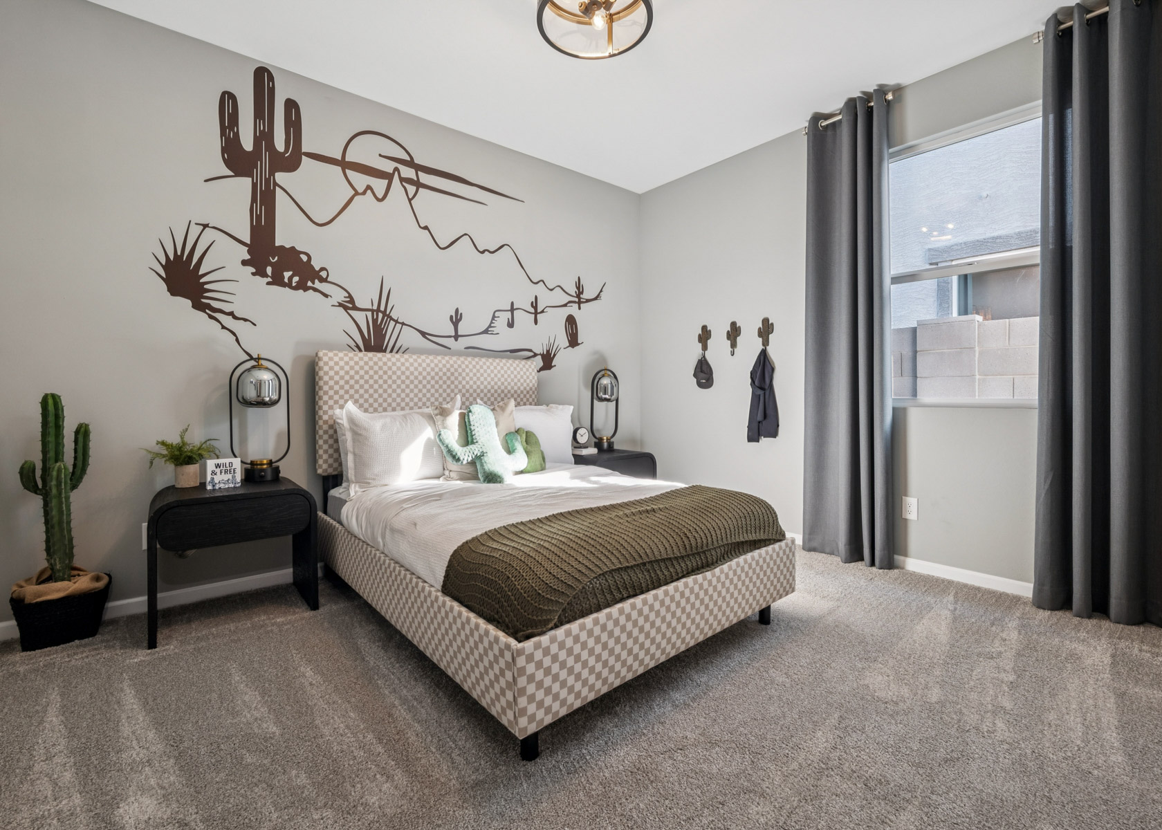 A bedroom with a bed and a lamp.