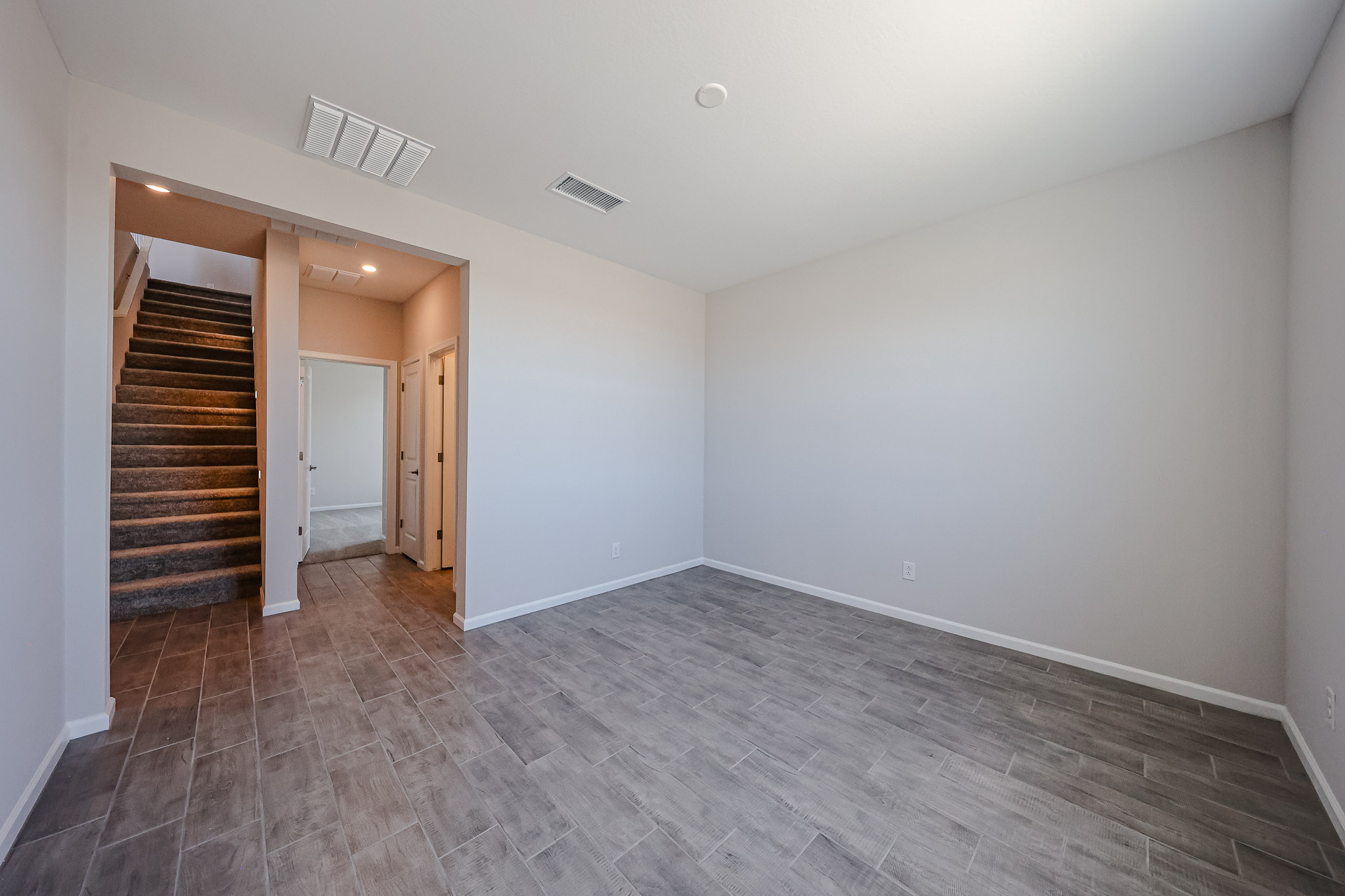 A hallway with wood doors.