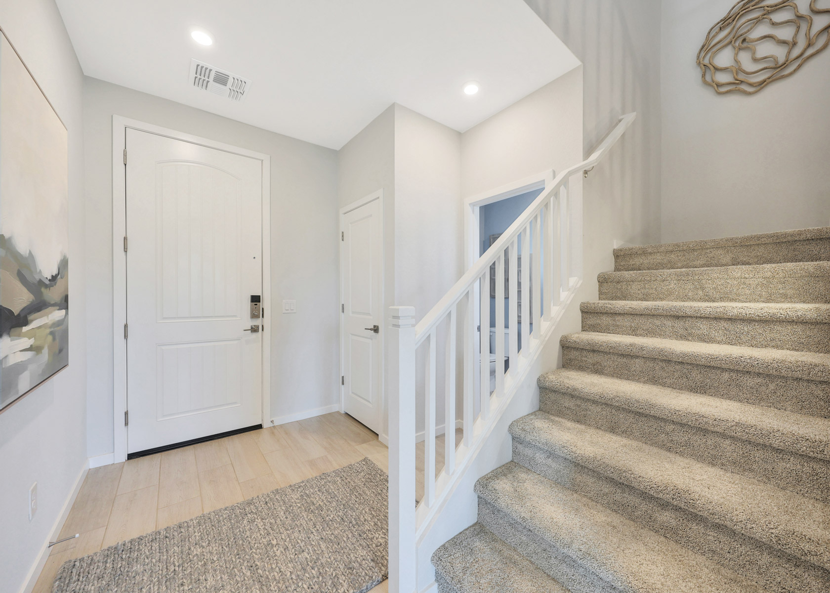 A staircase with white doors.