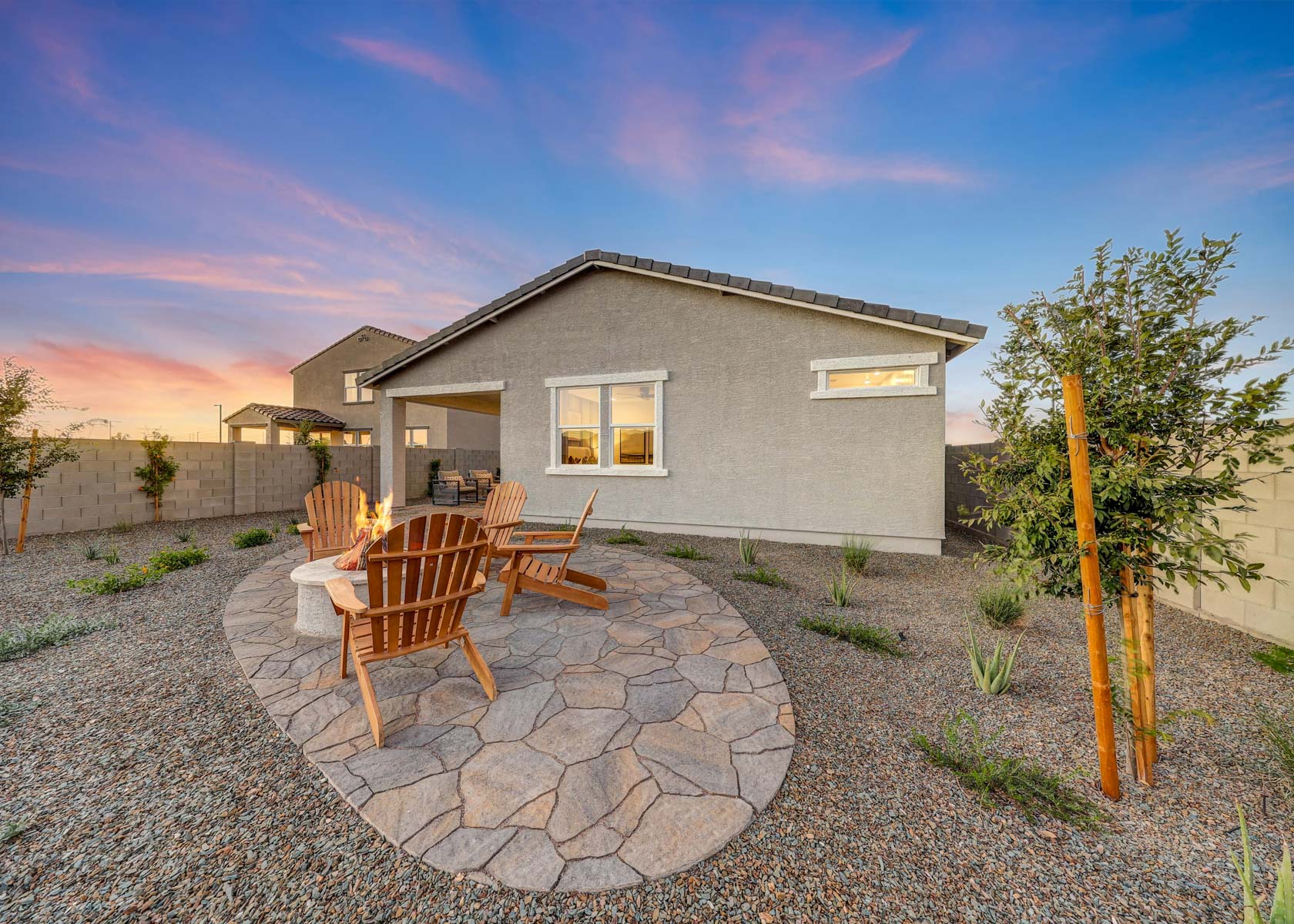 A house with a stone patio.