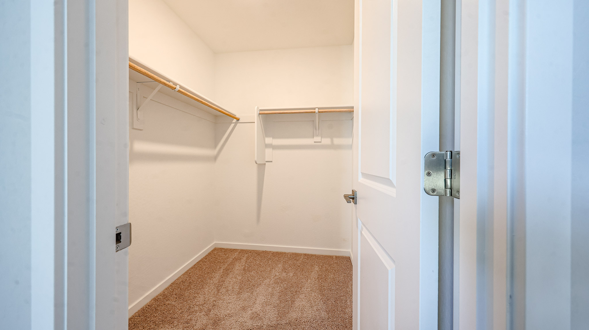 A hallway with white doors.