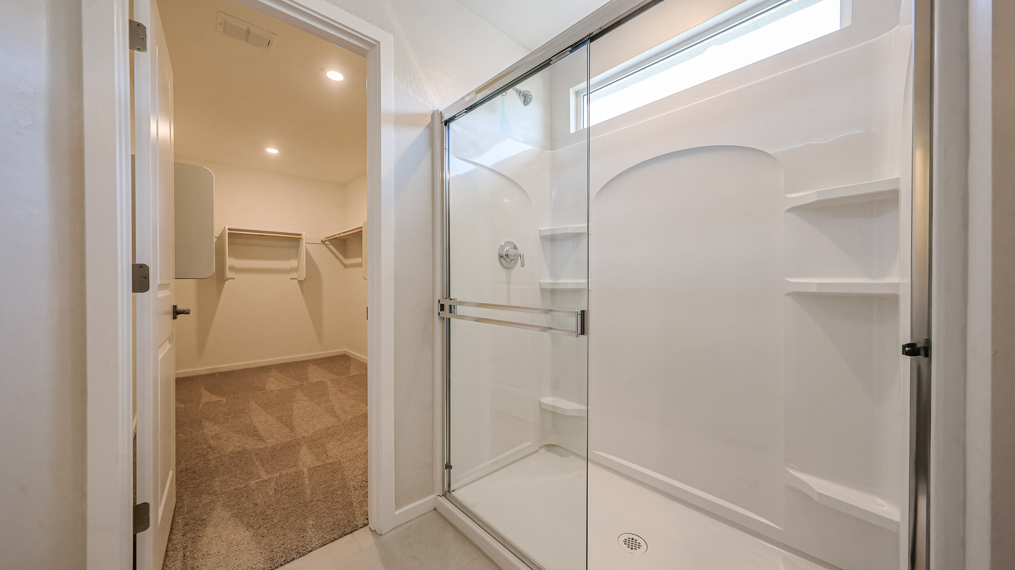 A bathroom with a shower unit.