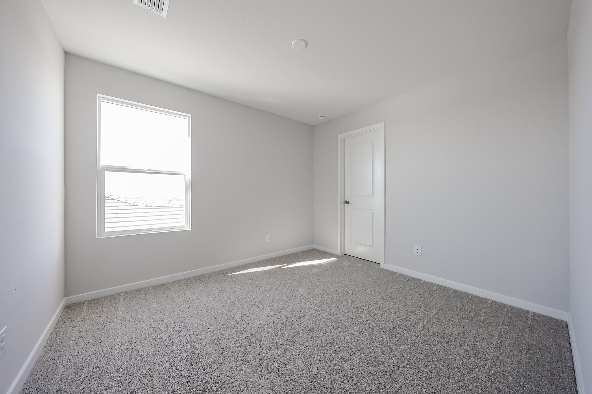 A room with a door and a window.