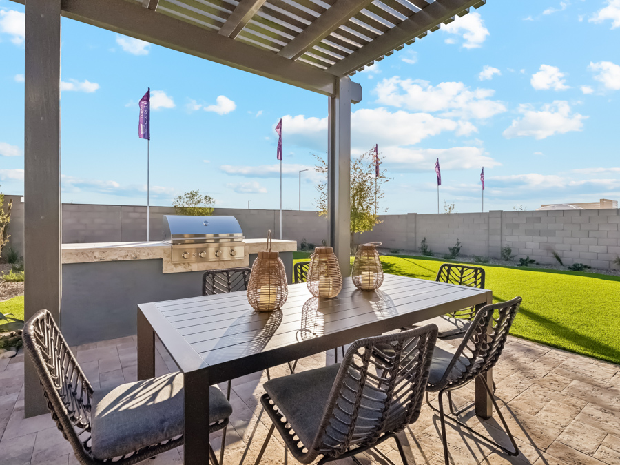 A table and chairs on a patio.