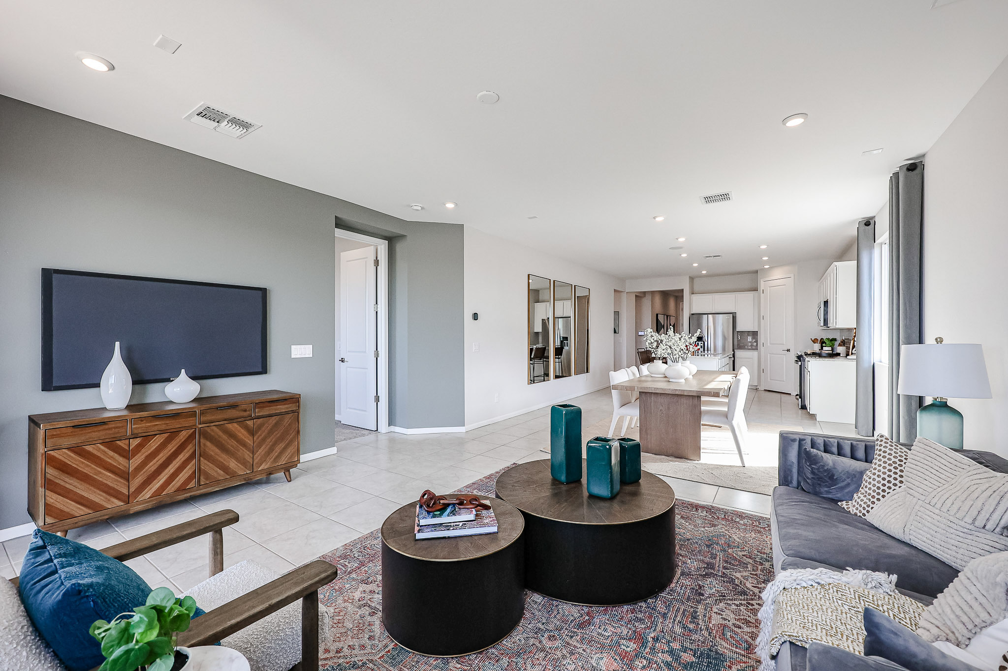 A living room with a large television.