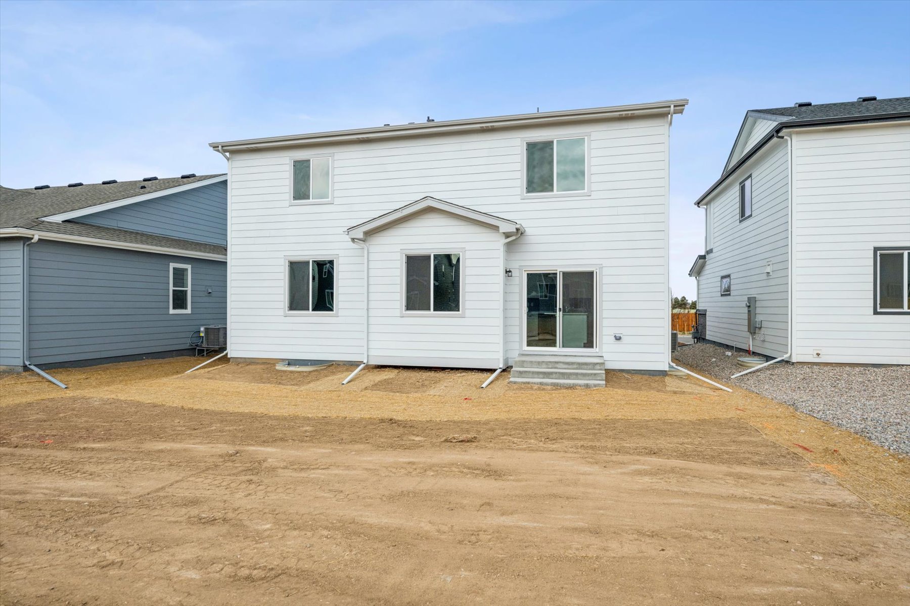 A house with a dirt yard.