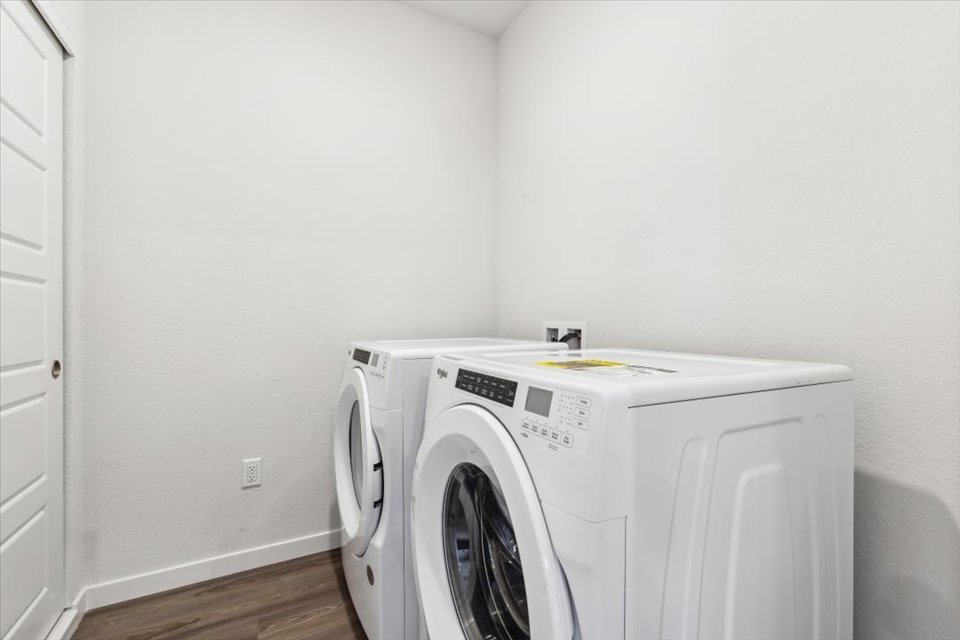 A white washing machine in a room.