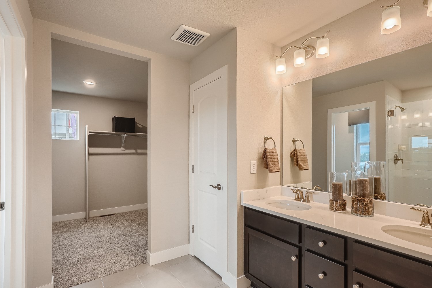 A bathroom with a large mirror.
