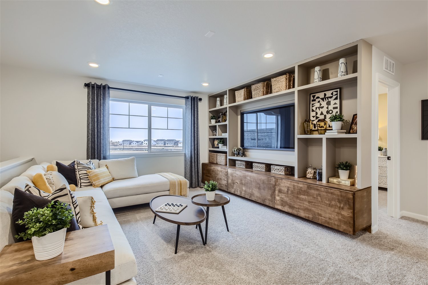 A living room with a tv and a couch.