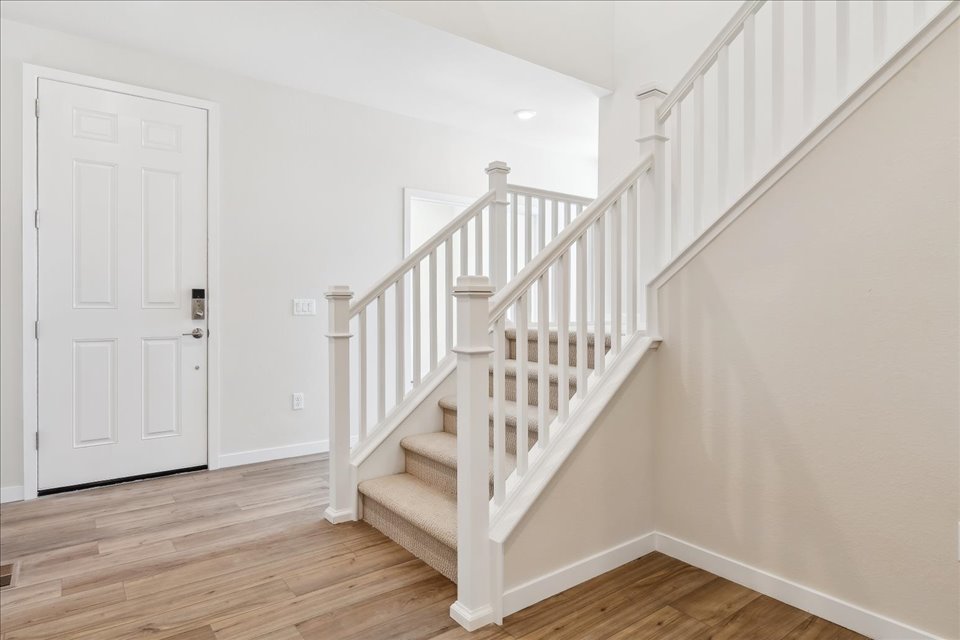 A white staircase in a house.