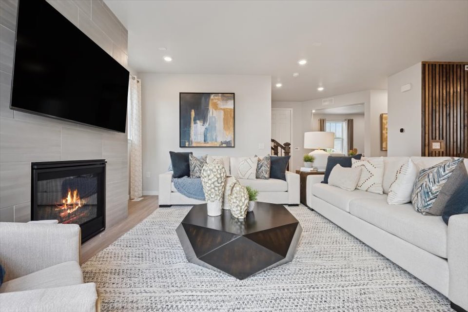 A living room with a fireplace.