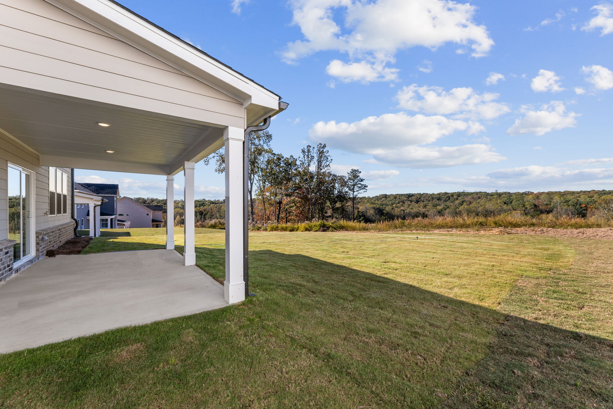 A building with a grass lawn.