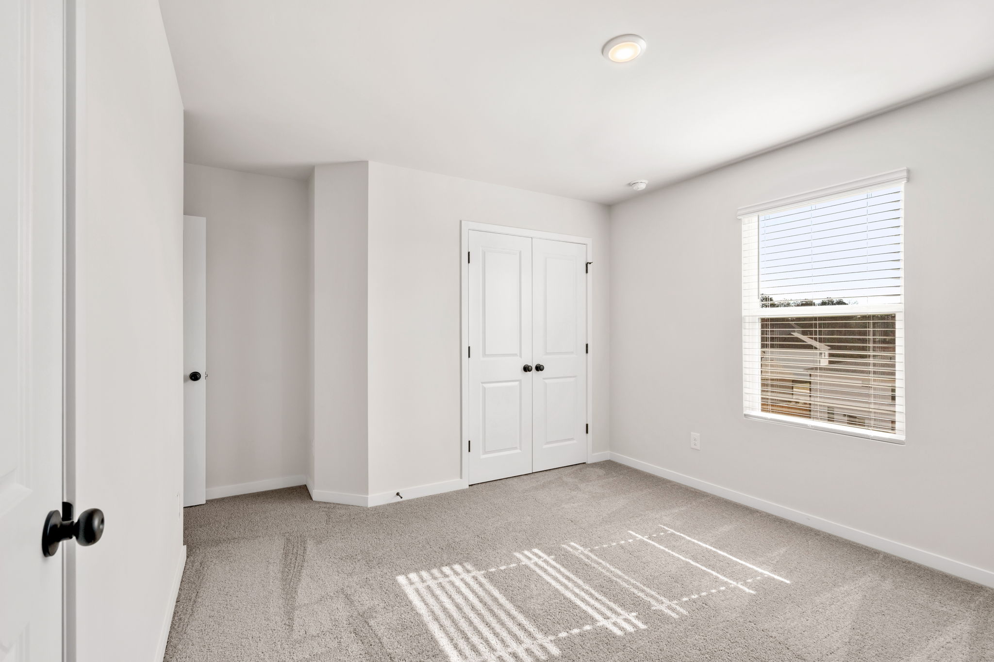 A room with white doors.