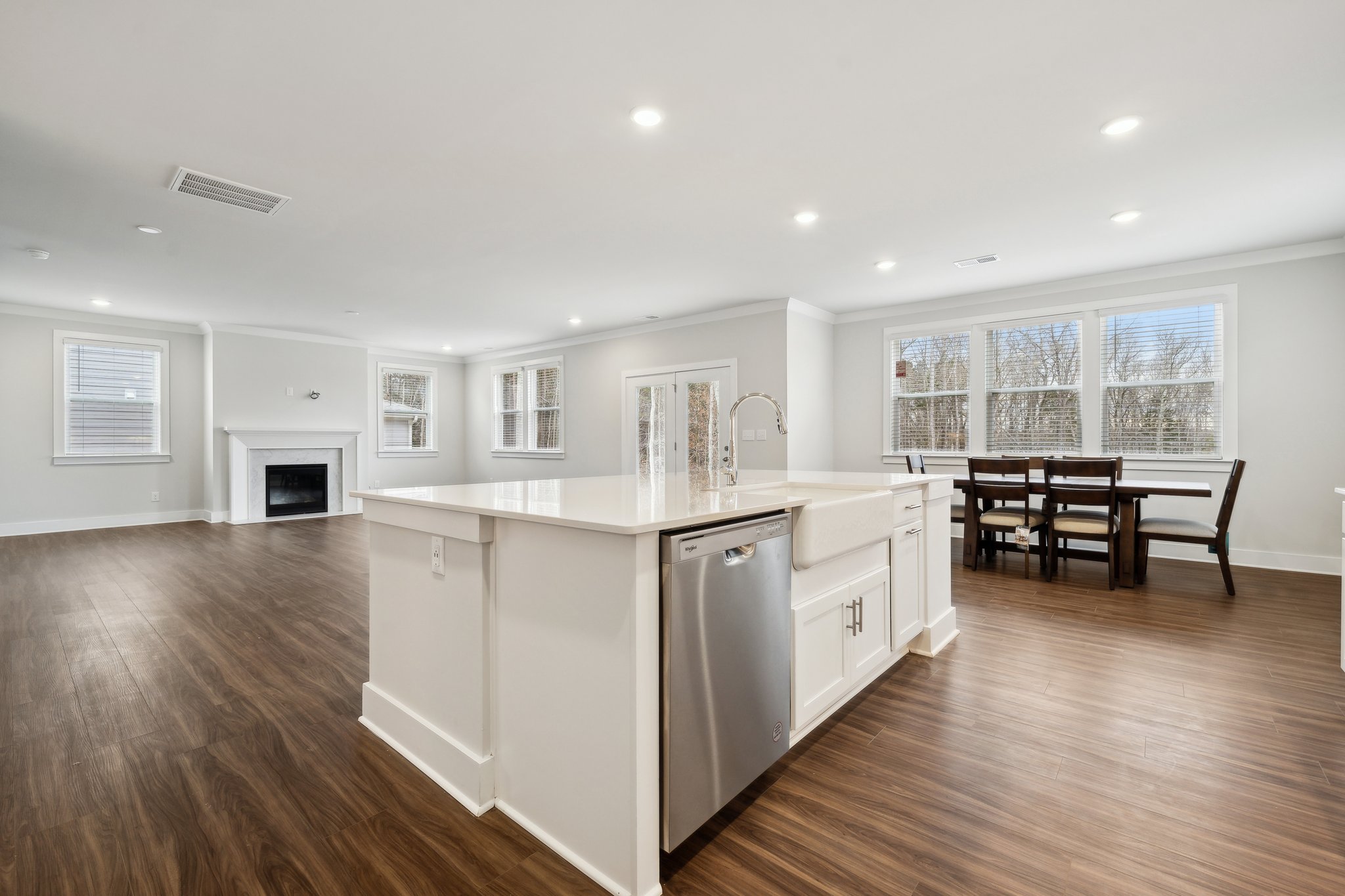 A large kitchen with white cabinets.