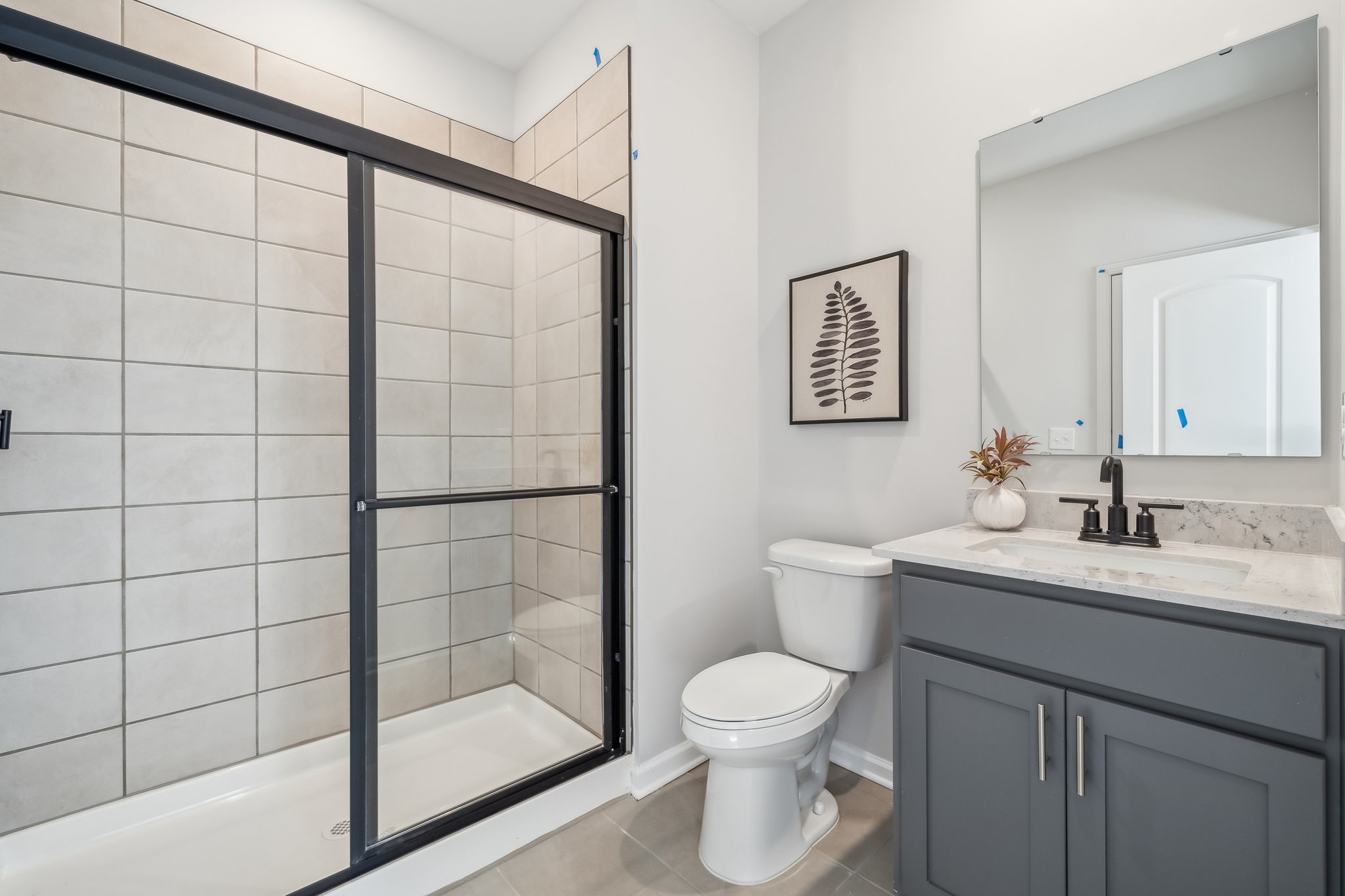 A bathroom with a glass shower.