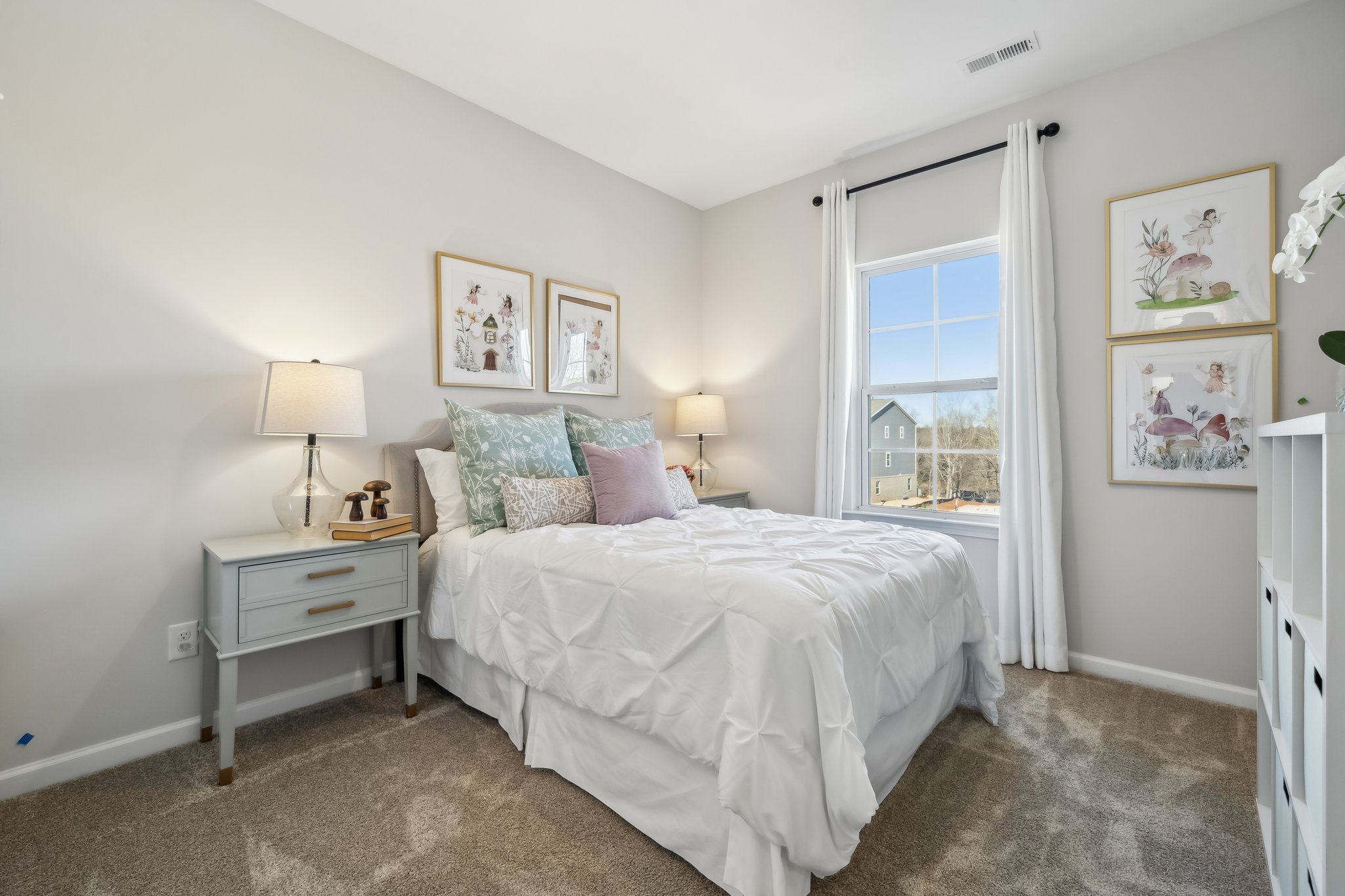 A bedroom with a bed and a window.