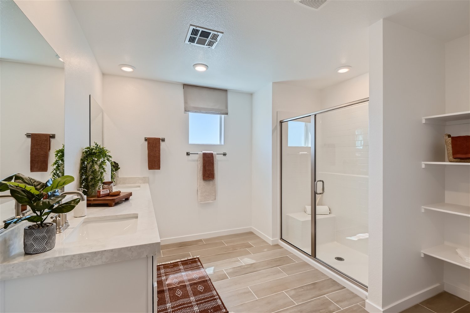 A bathroom with a glass shower.