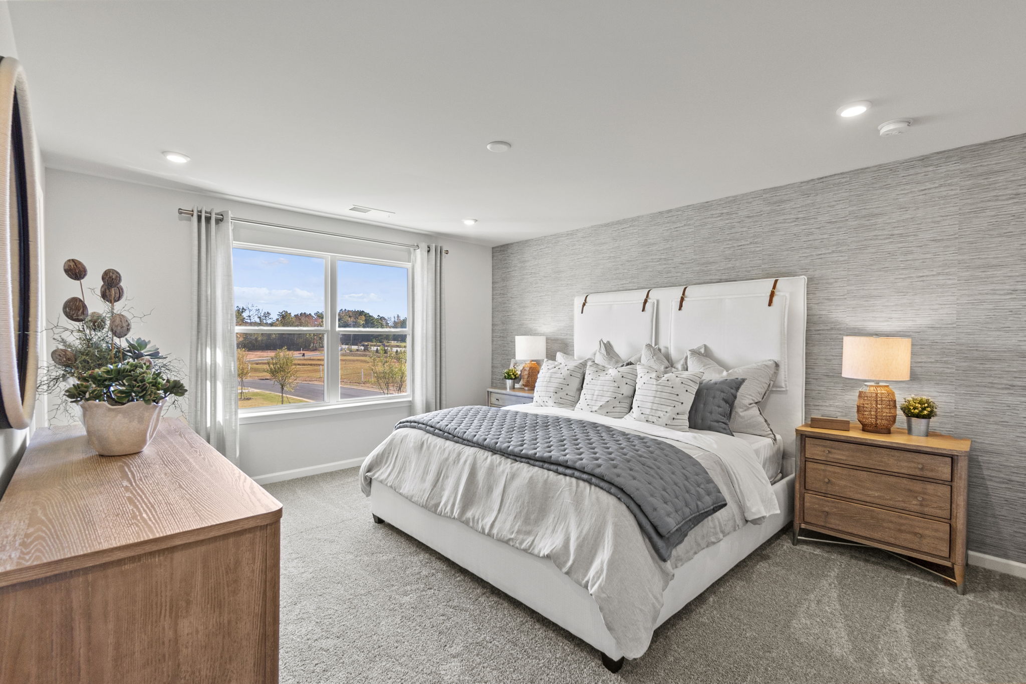 A bedroom with a large bed.