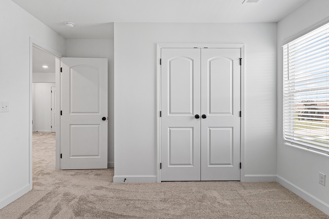 A room with white doors.