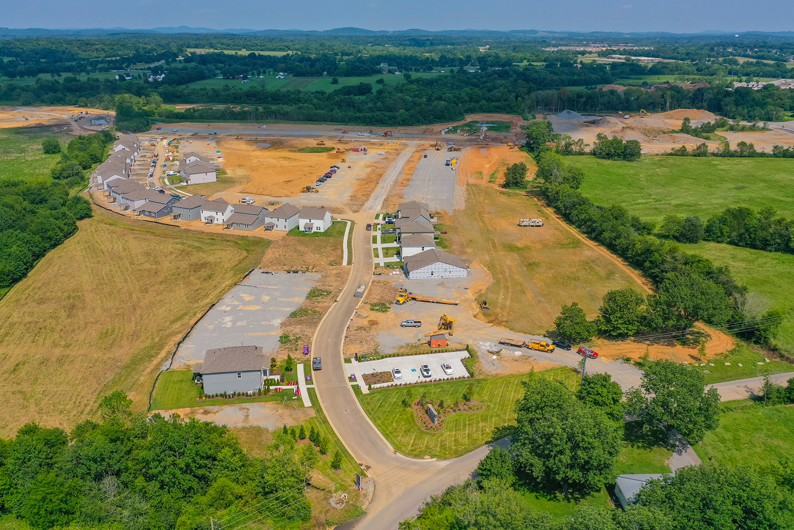 A road with a river and buildings.