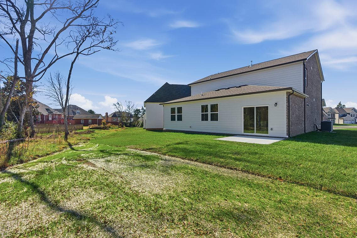 A house with a yard and trees.