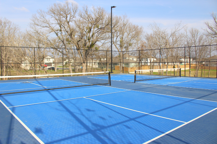 A tennis court with a net.