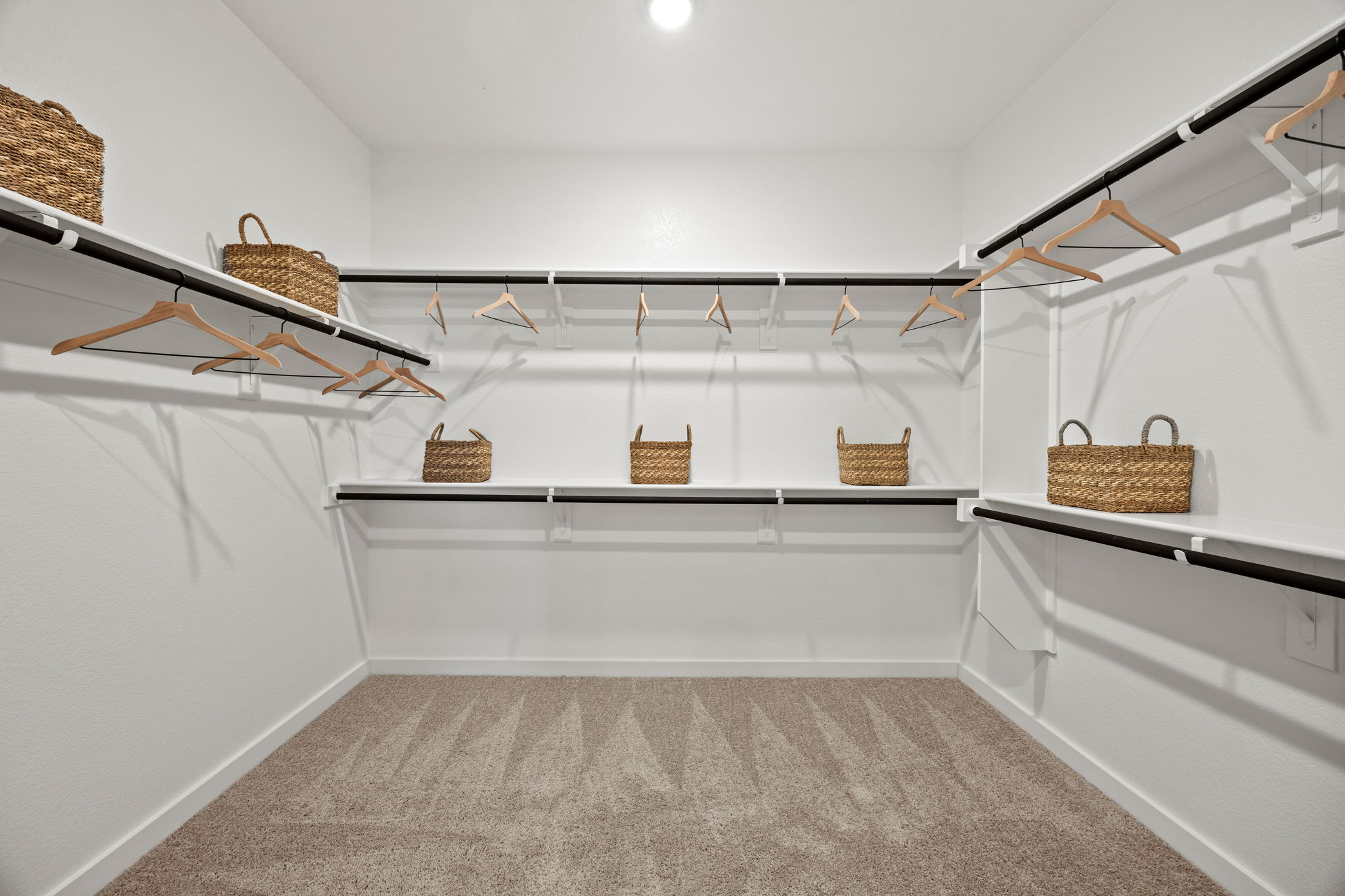 A white staircase with baskets and baskets.