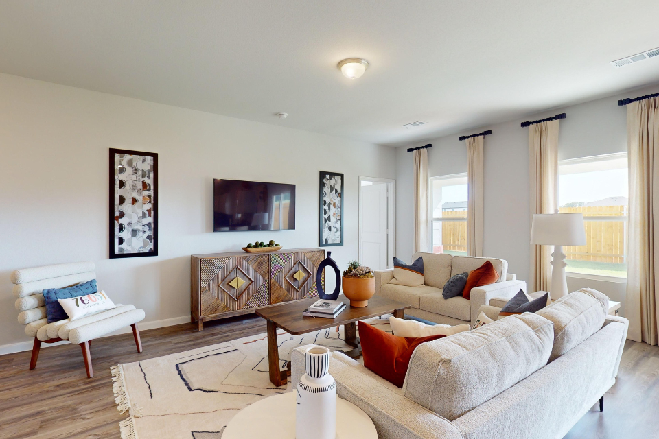 A living room with a large window.