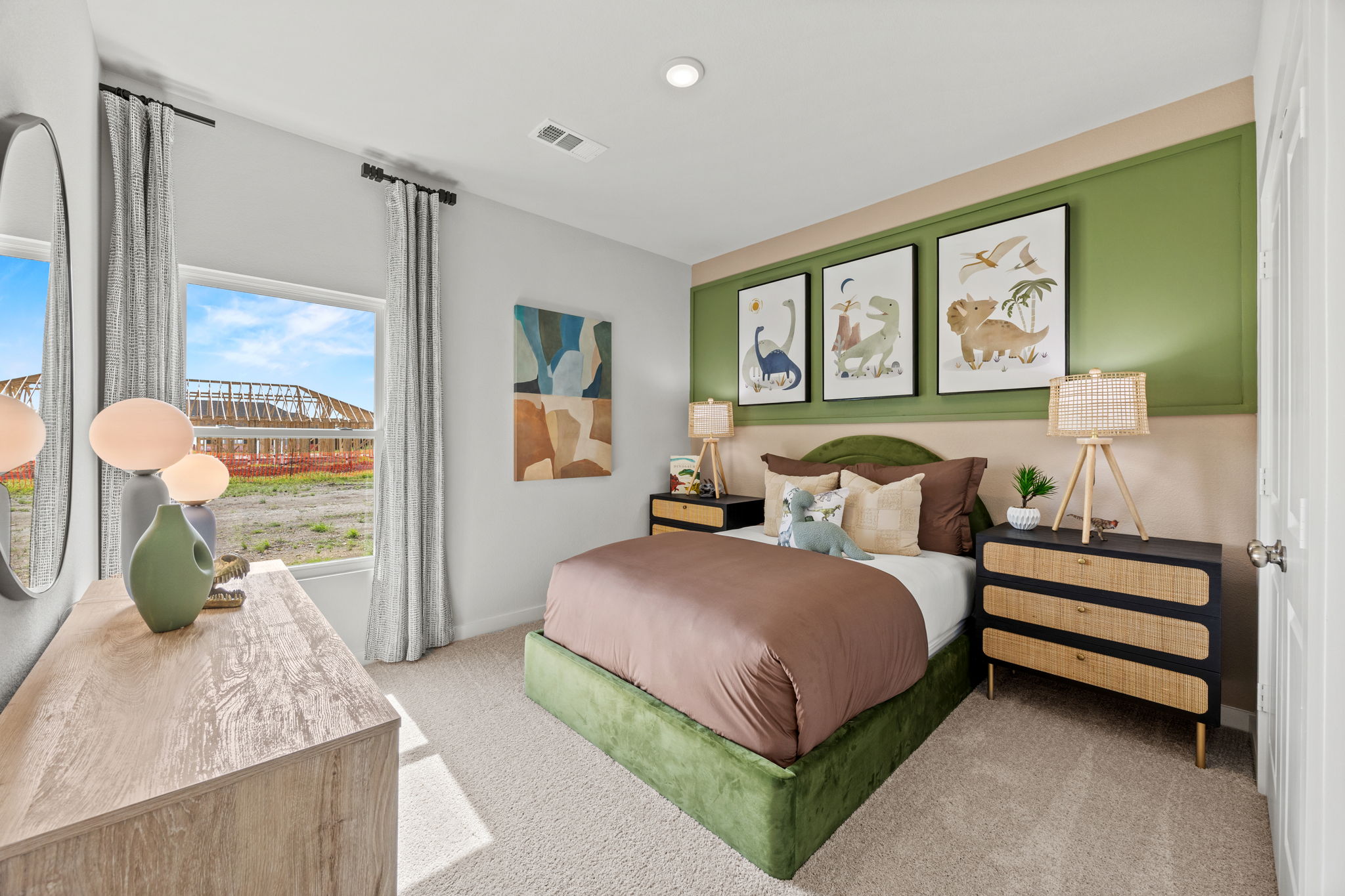 A bedroom with a large window.