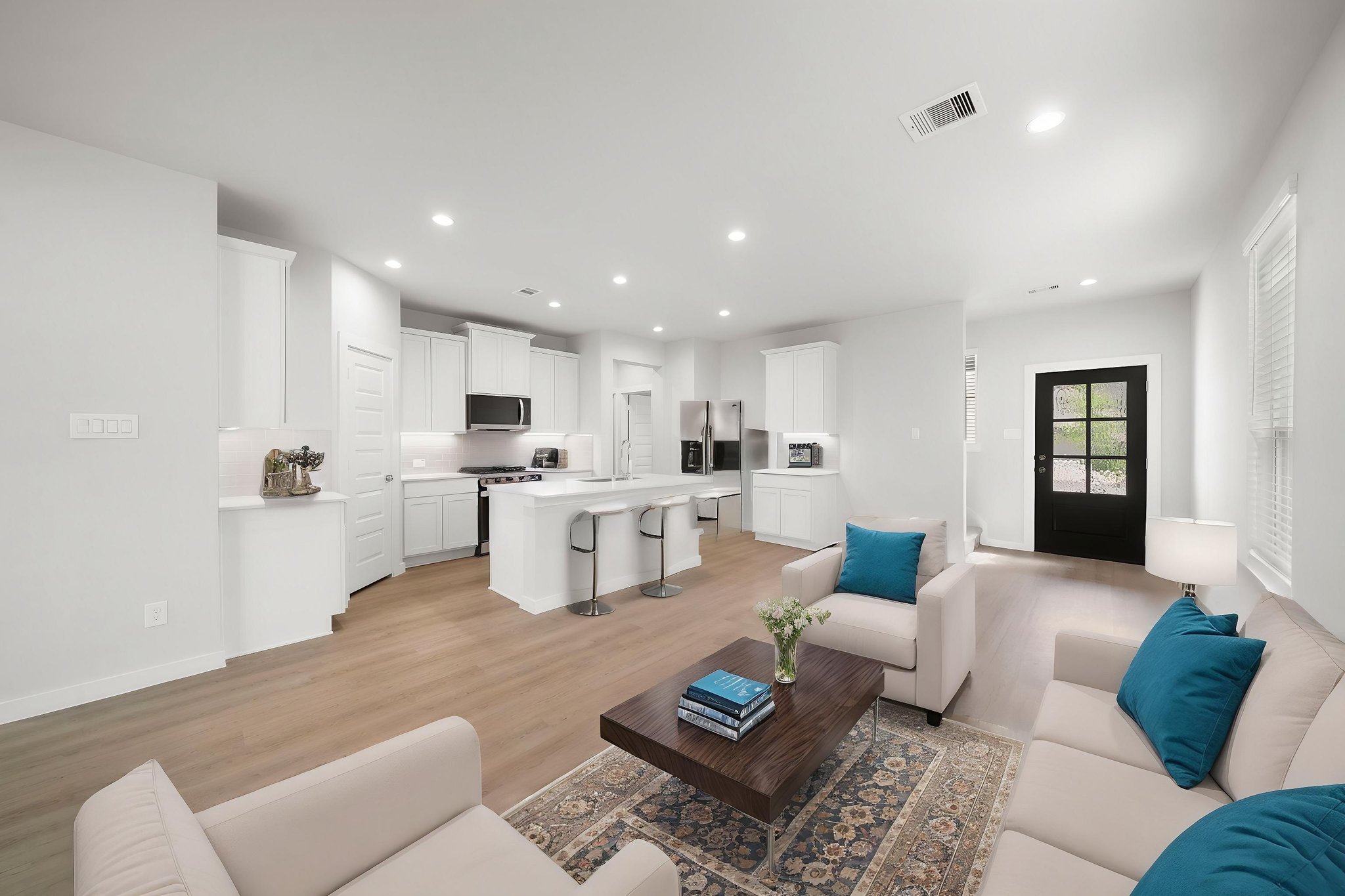 A large living room with white walls.