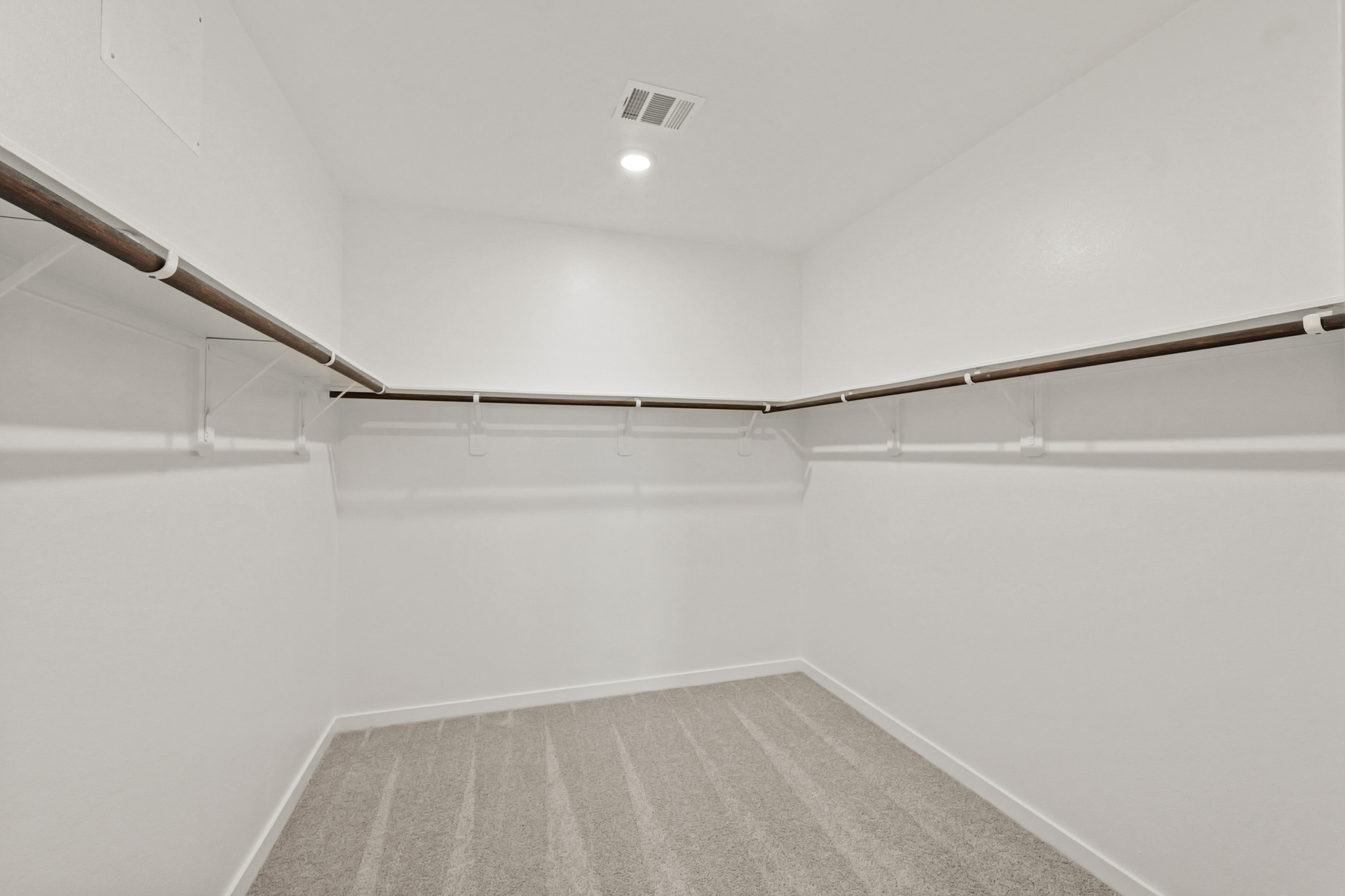 A white room with a staircase.