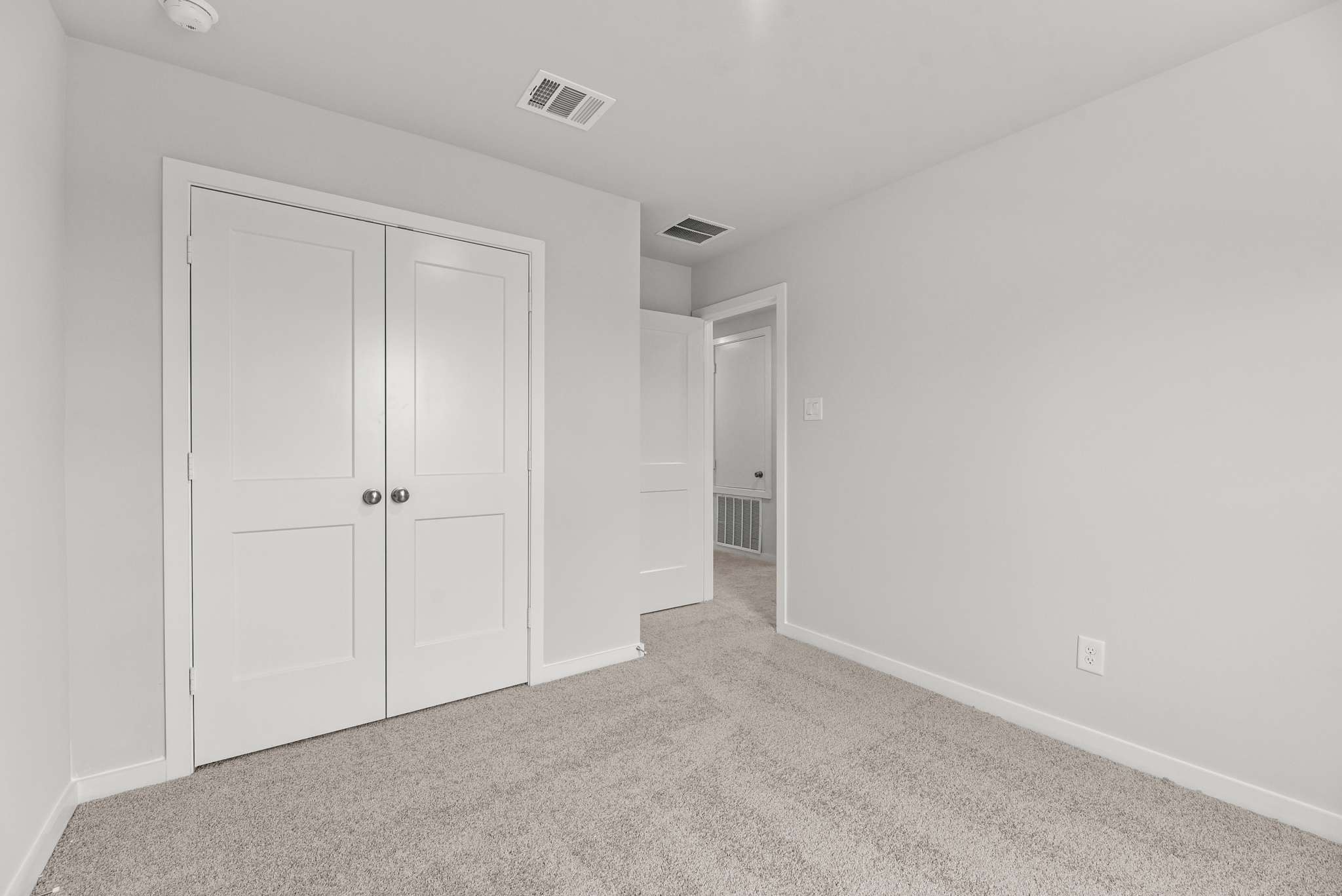 A room with white doors.