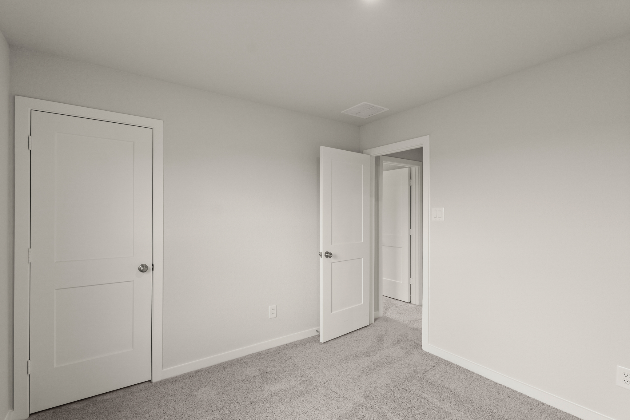 A room with white doors.