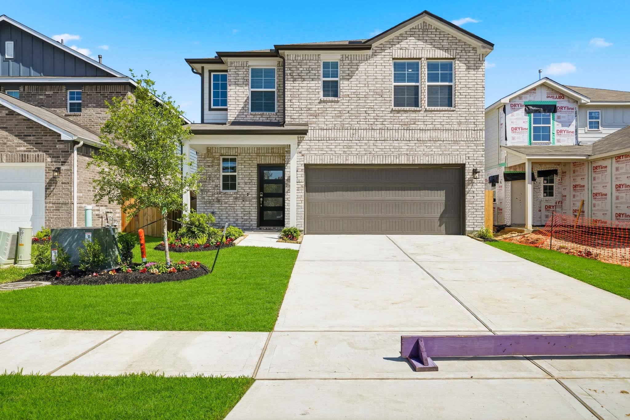 A large house with a driveway.