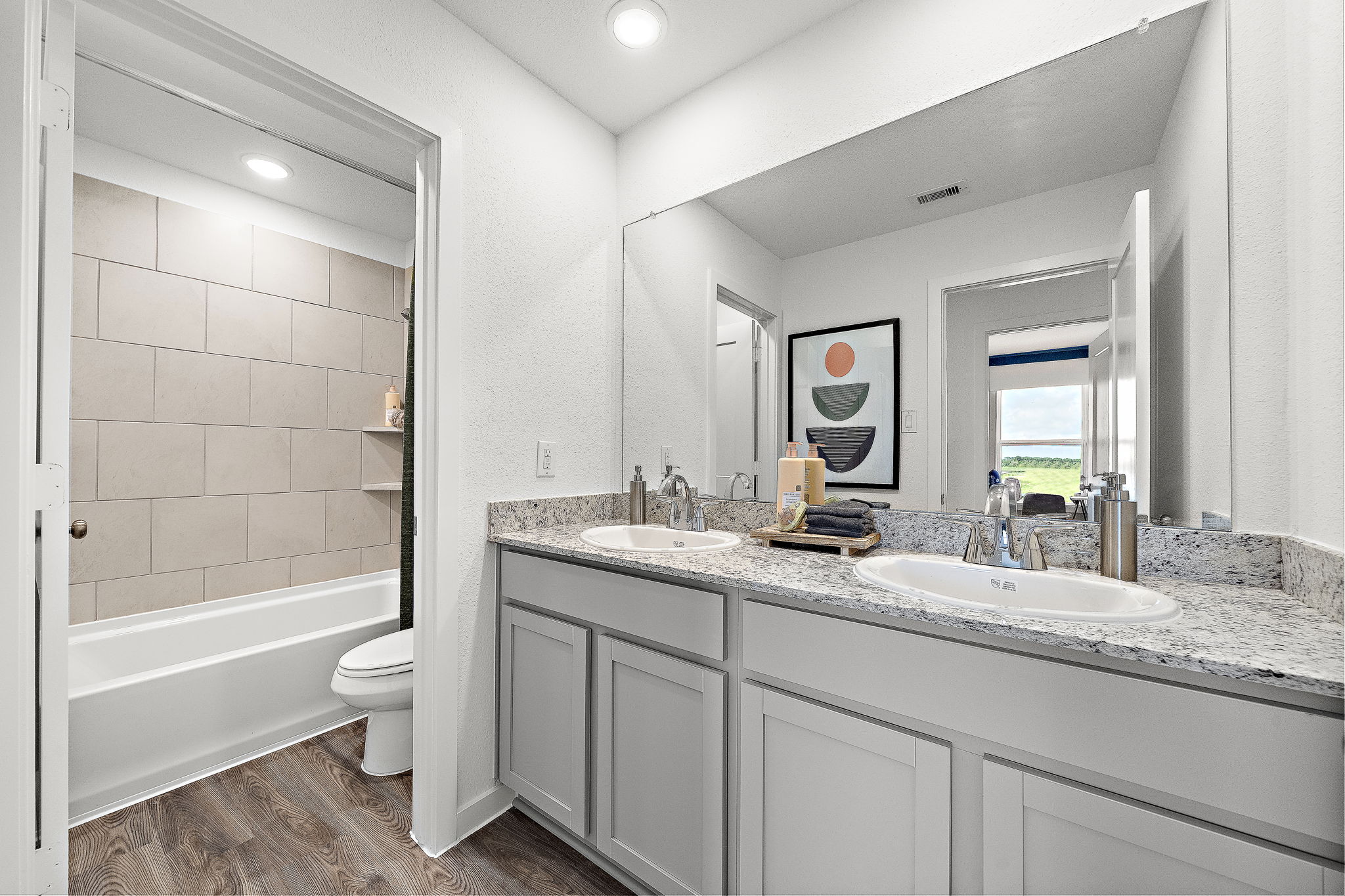 A bathroom with a marble countertop.