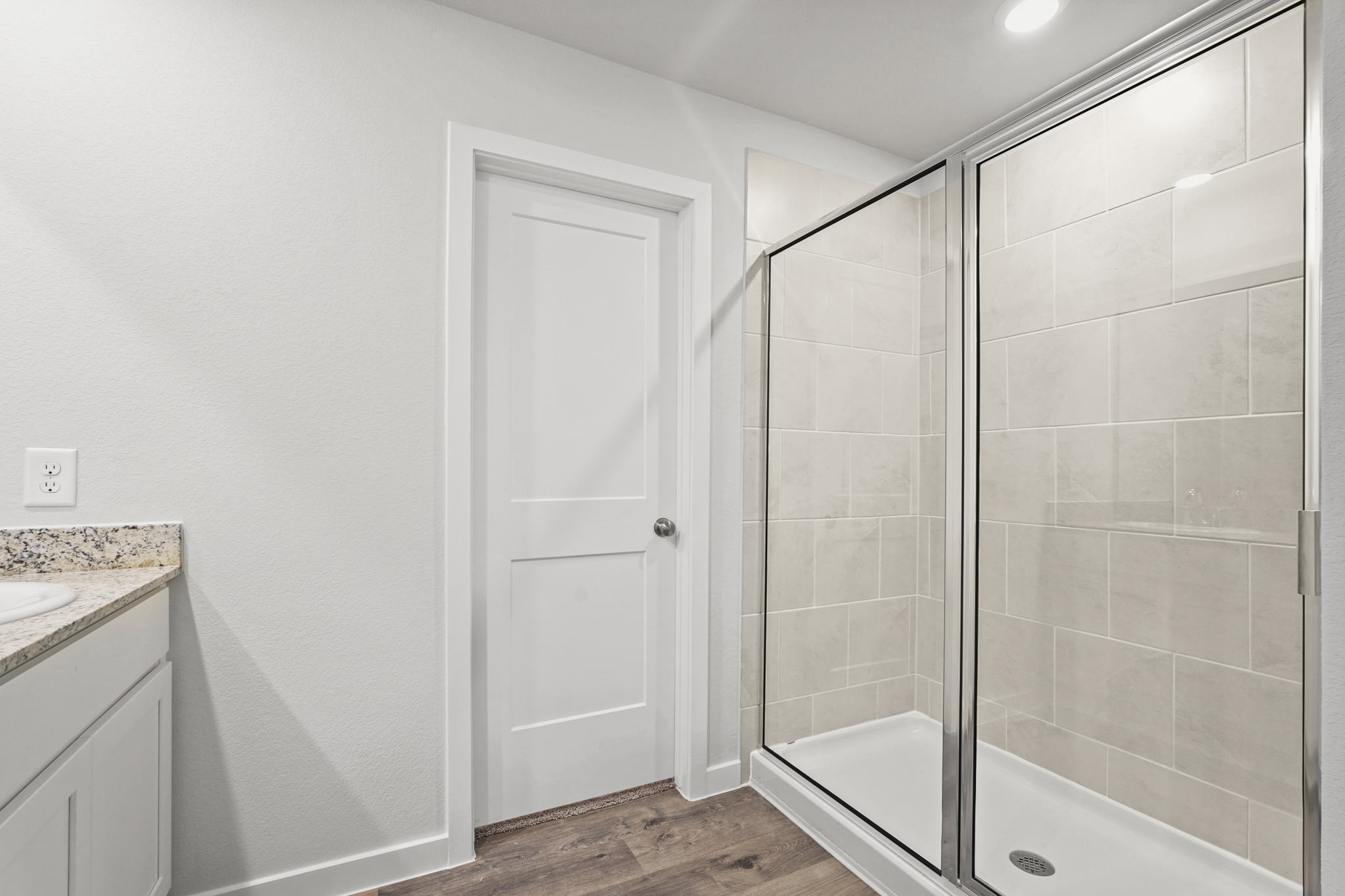 A bathroom with a glass shower.