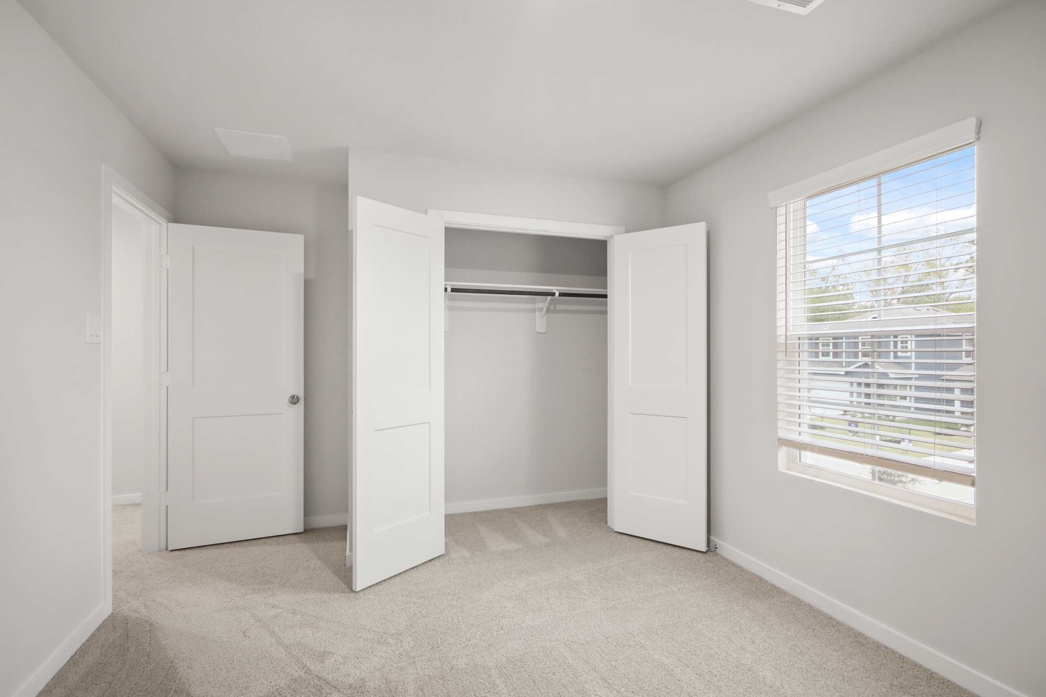 A room with white cabinets.