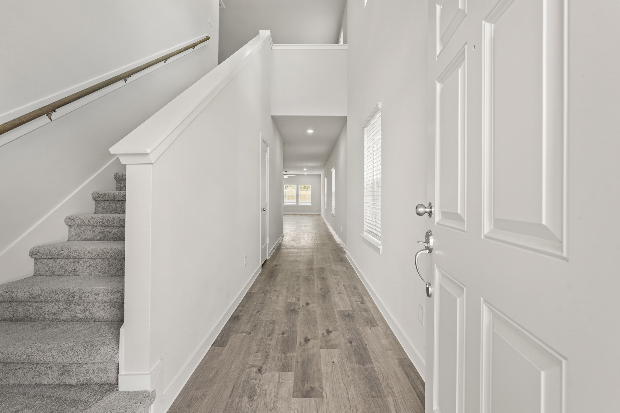 A hallway with white doors.