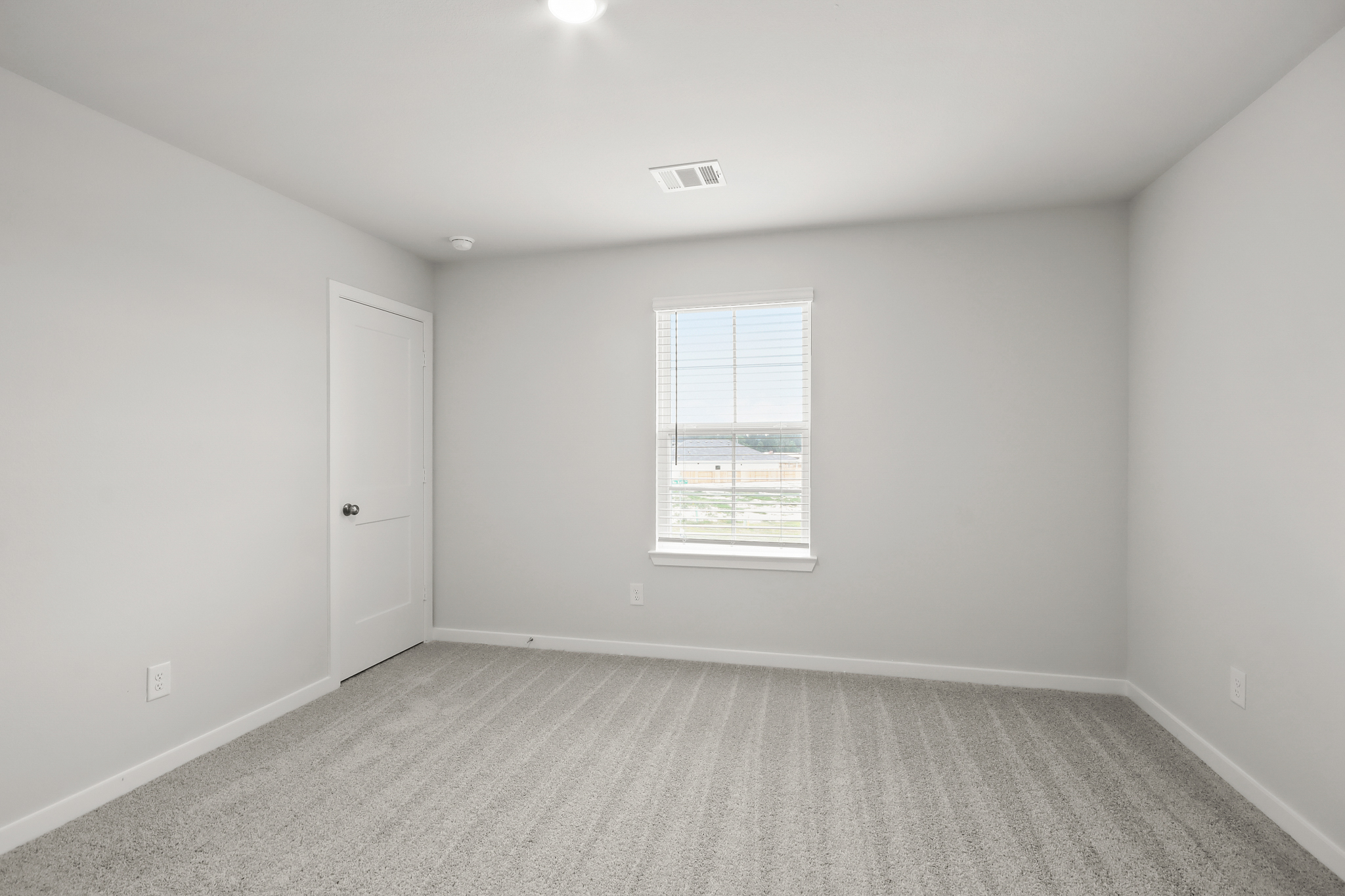 A room with a door and a window.