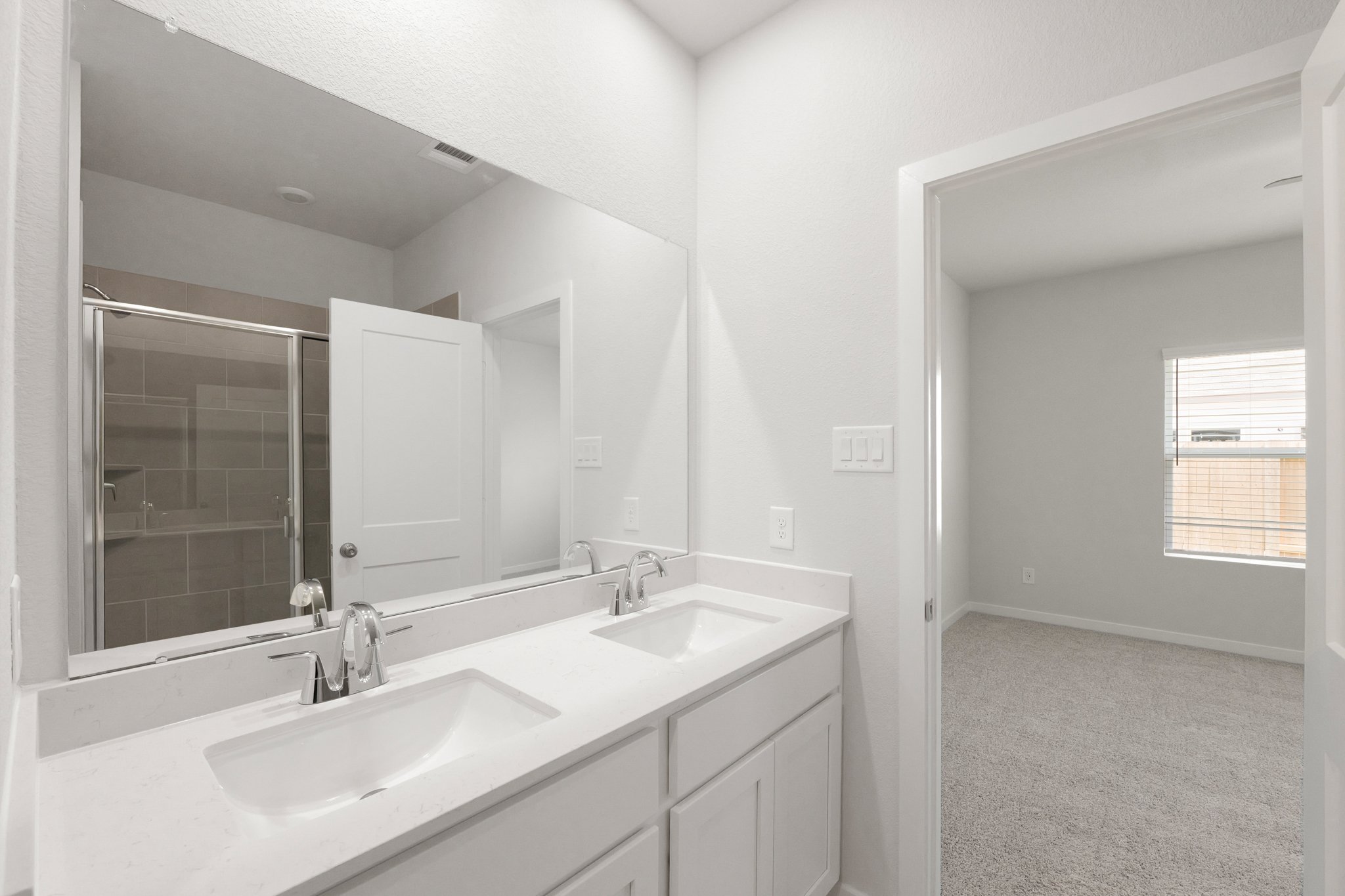 A bathroom with two sinks.