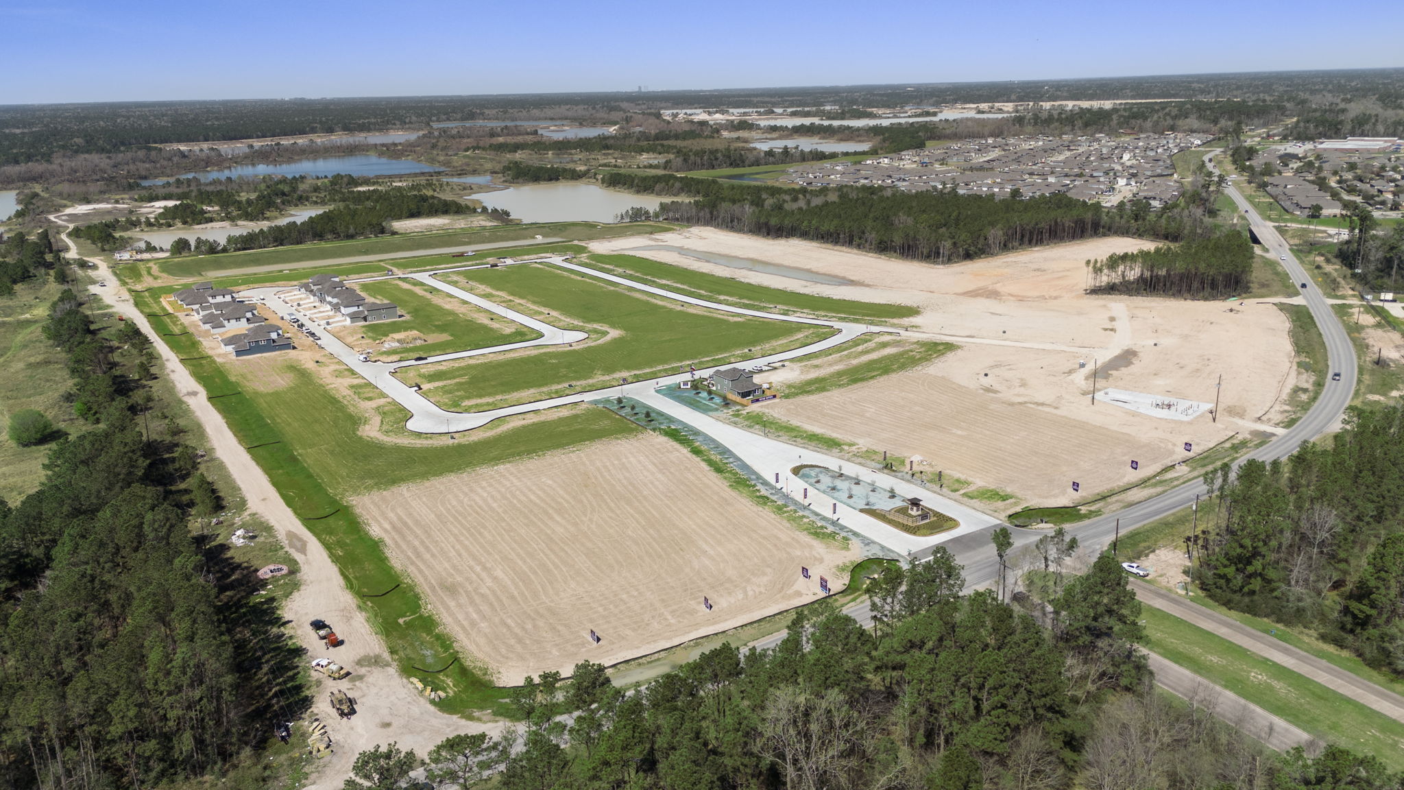 A large area with a road and trees around it.