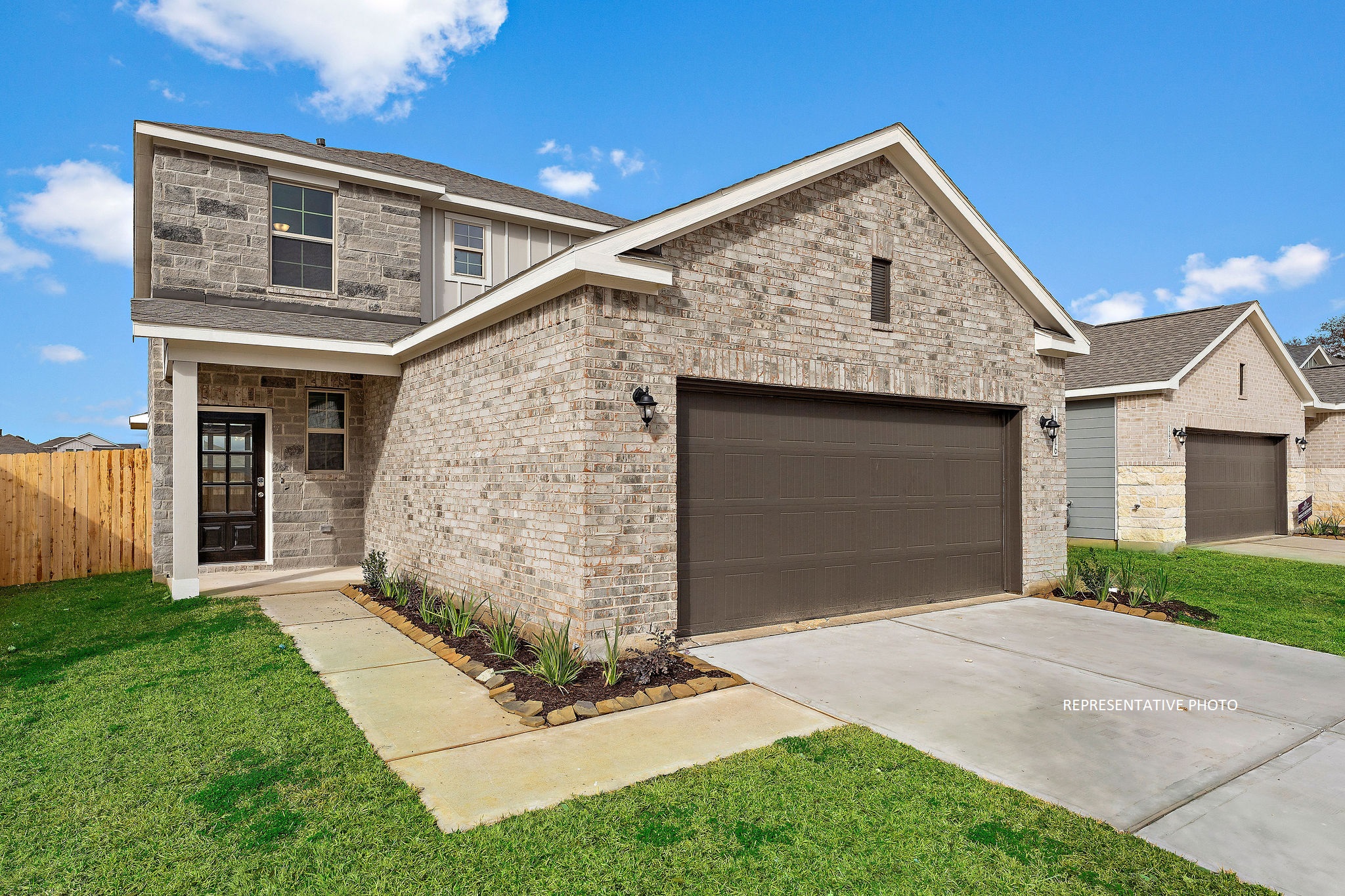 A stone house with a garage.