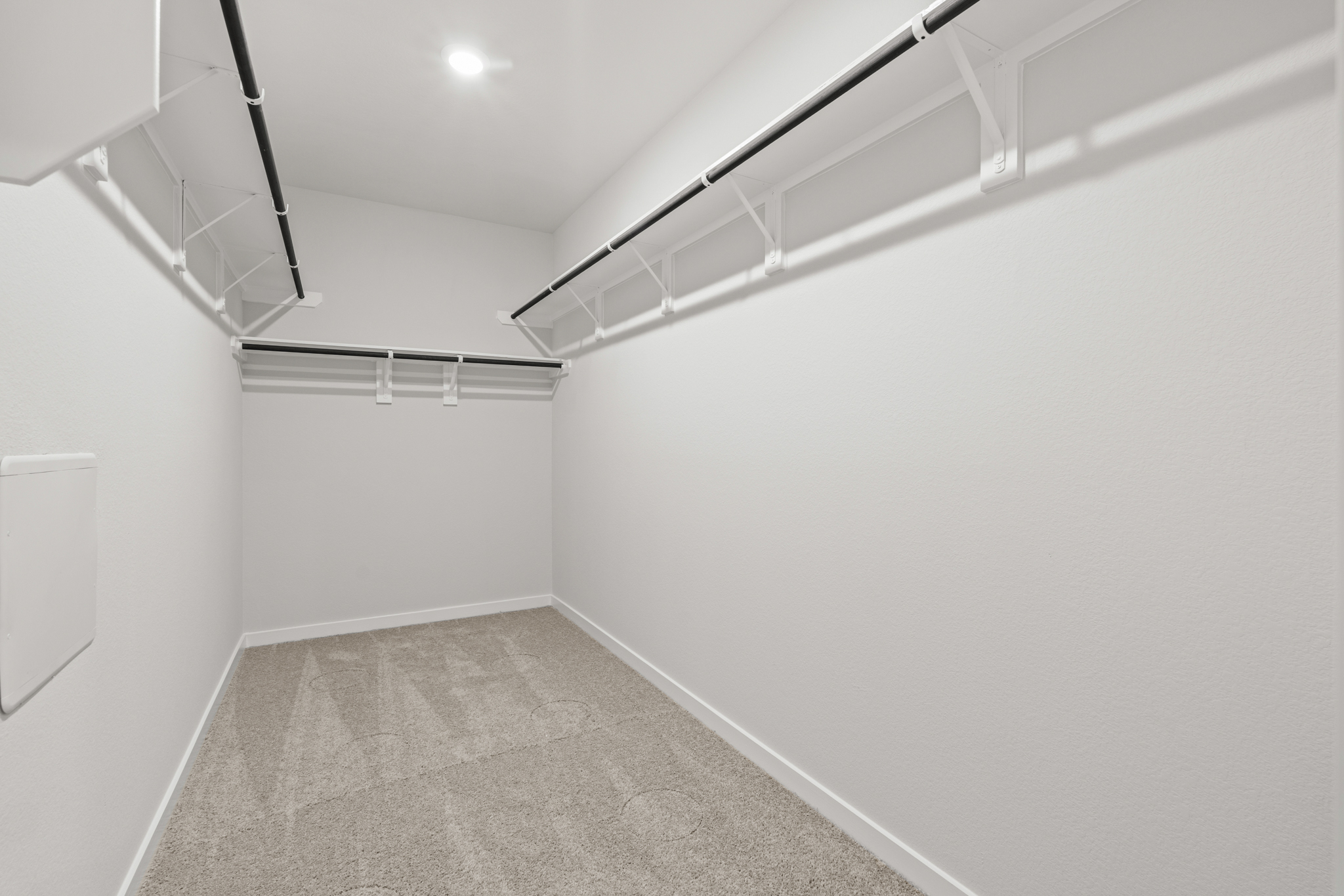 A hallway with white walls.